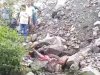 पत्थरों के नीचे दबा मिया शव 